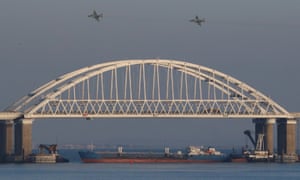 Russian jet fighters fly over a bridge connecting the Russian mainland with the Crimean peninsula.