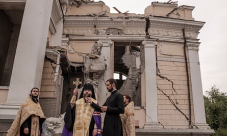 Archbishop holds up cross