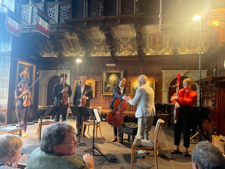 Composer Robin Holloway (in light suit) with the Kaleidoscope Chamber Collective and Orsino Winds, including bassoonist Amy Harman, right, after the premiere of his bassoon quintet at Hatfield House.