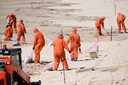 Workers cleaning Coogee beach