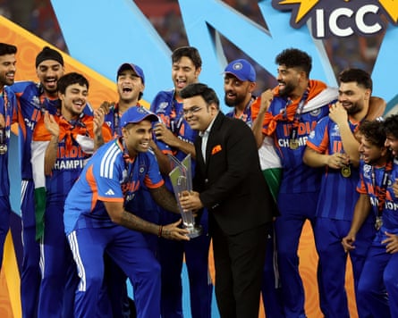 Suryakumar Yadav and Jay Shah lift the trophy after the ICC men’s T20 World Cup match between India and New Zealand