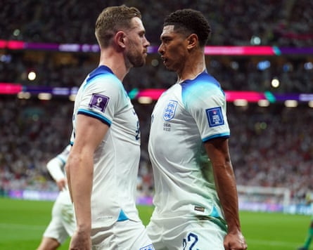 Jordan Henderson and Jude Bellingham puff their chests after England’s first goal against Senegal in the 2022 World Cup last 16