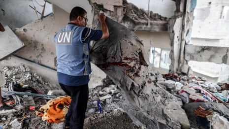 People look through rubble after Israeli strike on UN school in Gaza that killed dozens – video