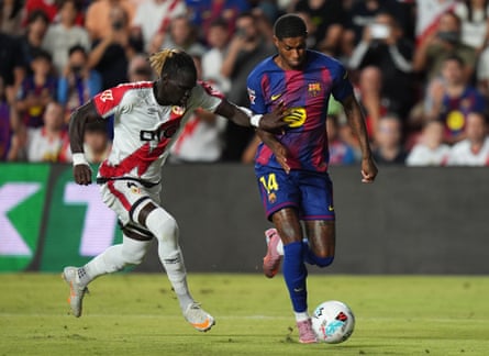 Marcus Rashford of Barcelona being followed by Pathé Ciss of Rayo Vallecano successful a La Liga match.