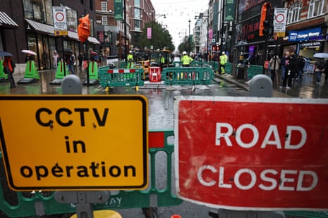 Bollards prevent road users on Oxford Street in London today