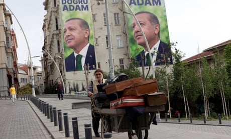 A vendor in Istanbul with election posters of Turkish president Tayyip Erdoğan in the background
