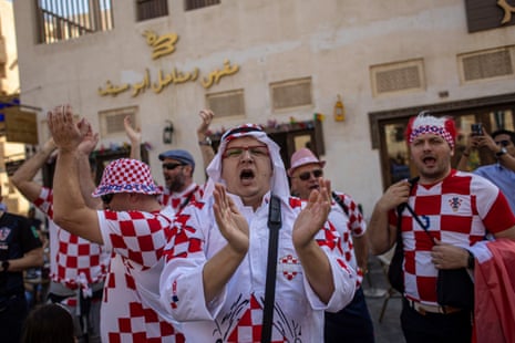 Fans of Croatia cheer at the Souq Waqif market during ahead of today’s match.