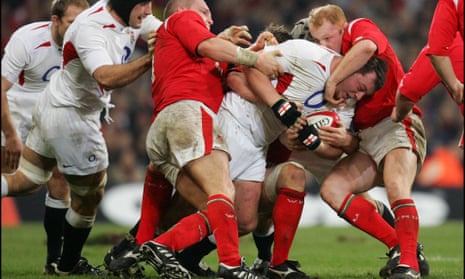 Former England rugby player Steve Thompson, who has revealed that he has early-onset dementia, is tackled during a six nations game against Wales.