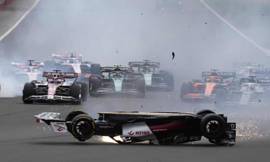 Alfa Romeo driver Guanyu Zhou of China crashes at the start of the British Formula One Grand Prix