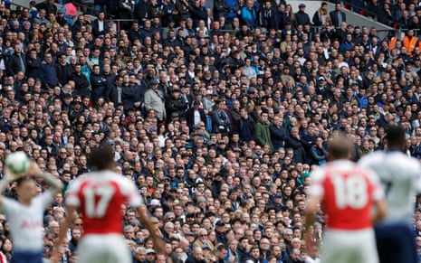 Fans watch the action during the Premier League match between Tottenham Hotspur and Arsenal.