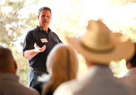 a man speaks to a crowd of people