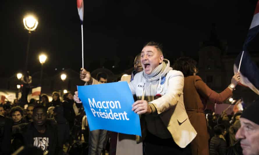 Macron supporters celebrate victory in Paris.