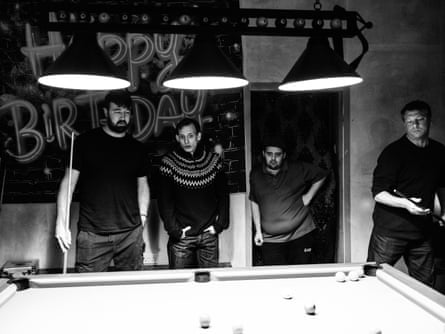 Four men play a pool match