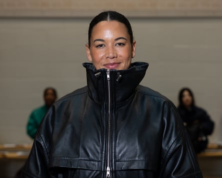 Tatyana Heard wears a black funnel-neck jacket at London fashion week.