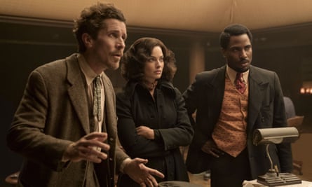 This image released by 20th Century Studios shows, from left, Christian Bale, Margot Robbie and John David Washington in a scene from “Amsterdam.” (Merie Weismiller Wallace/20th Century Studios via AP)