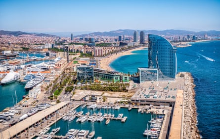 Port Vell harbour, Barcelona, with one of the city’s beaches in the distance.