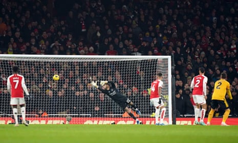 Wolverhampton Wanderers’ Matheus Cunha fires a shot past Arsenal goalkeeper David Raya to score a goal for the visitors.