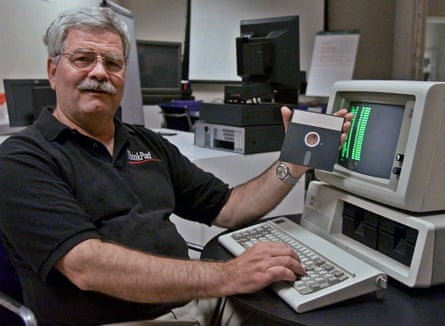 IBM developer David Bradley with a 5150 computer and DOS floppy disk.
