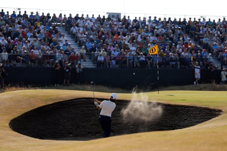 Tommy Fleetwood plays out from the bunker on the 14th.
