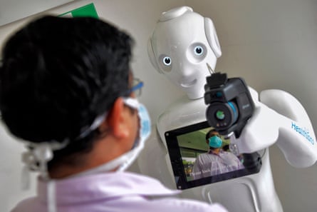 Mitra is equipped with a thermal camera to screen patients before directing them at Fortis hospital in Bengaluru.