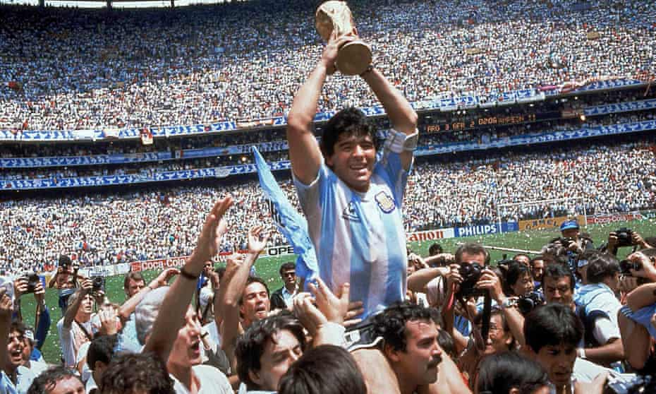 Fans invade the pitch to hold Diego Maradona aloft after Argentina’s World Cup final win in 1986