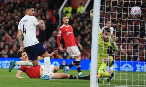 Manchester United’s Harry Maguire (left) looks on as he deflects a cross into his own net for Tottenham’s second goal.