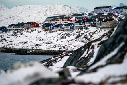 Colourful houses sit amid the black-and-white landscape of Greenland’s capital, Nuuk