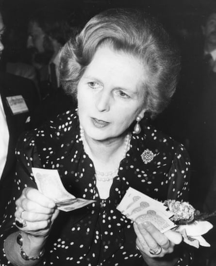 Margaret ThatcherBritish Prime Minister Margaret Thatcher holding a handful of one pound notes at a Tombola stall during a celebration ball, as part of the Conservative Party Conference, Brighton, October 10th 1980. (Photo by Graham Turner/Keystone/Hulton Archive/Getty Images)