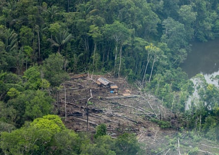 Shot from the air, an illegal gold mining site in a forest clearing on the banks of the Nanay River in Loreto, Peru.
