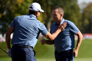 Sergio Garcia and Rafa Cabrera Bello react to winning the ninth.