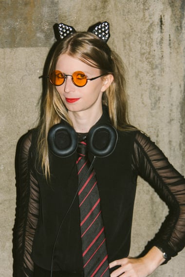 Portrait of manning with headphones and cat ears