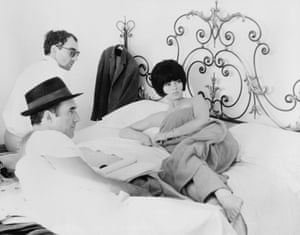 Jean-Luc Godard discusses a bedroom scene with Brigitte Bardot and Michel Piccoli  on the set of Le mépris, 1963