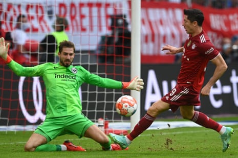 Kevin Trapp (left) spreads himself to deny Robert Lewandowski – one of a number of important saves he  made at the Allianz Arena.