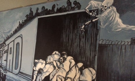 Murals at Altar’s migrant shelter show the dangers faced by border crossers.