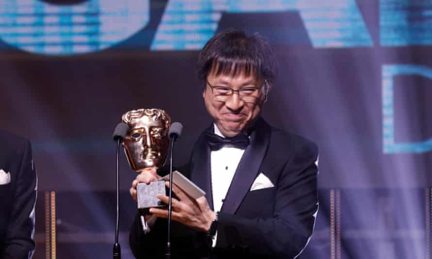 Nintendo’s Shinya Takahashi accepts a BAFTA award for Super Mario Odyssey in 2018.