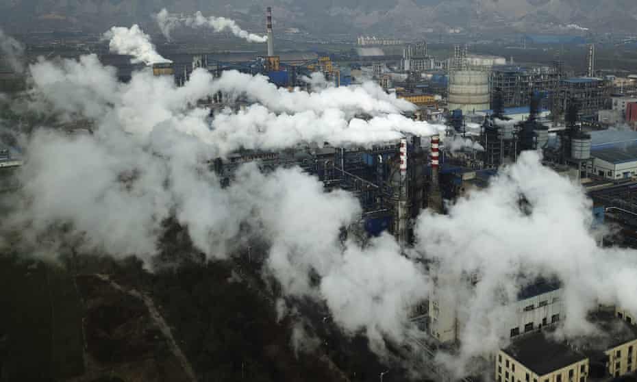 Smoke and steam rise from a coal processing plant in Hejin in China’s Shanxi province