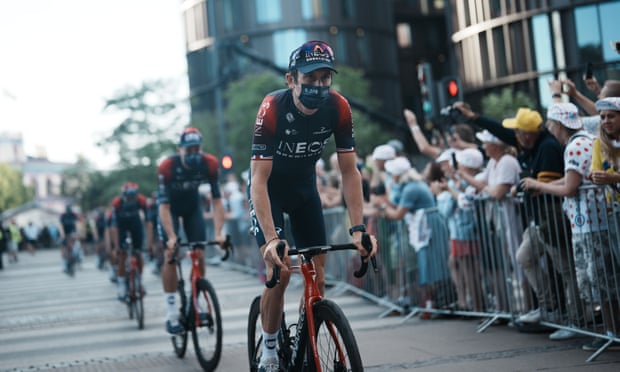 Geraint Thomas leads the Ineos Grenadiers as they arrive for the team presentation in Copenhagen  with fans lining the road.