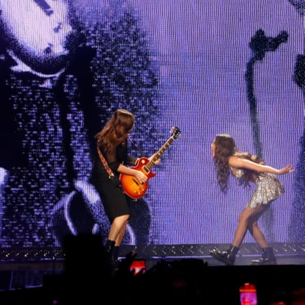 Olivia Rodrigo performing with guitarist Emily Rosenfield