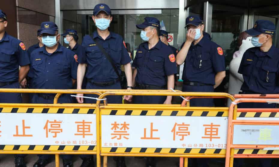 Police officers on duty in Taipei to enforce Taiwan’s strict coronavirus regulations