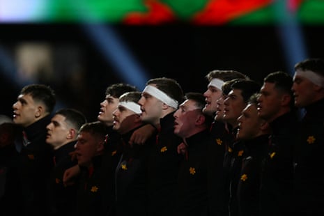 Wales' players sing their anthem ahead of kick-off against Scotland.