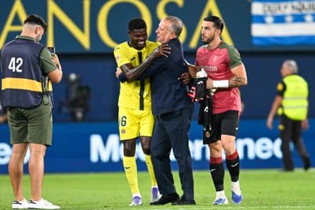 Thomas Partey is embraced by the Villarreal president, Fernando Roig, at full-time.