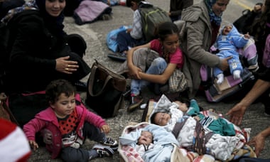 Syrian babies and children wait at the port of Piraeus, near Athens.