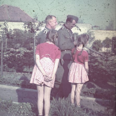 Brigitte and Heidetraud with soldiers in Auschwitz.