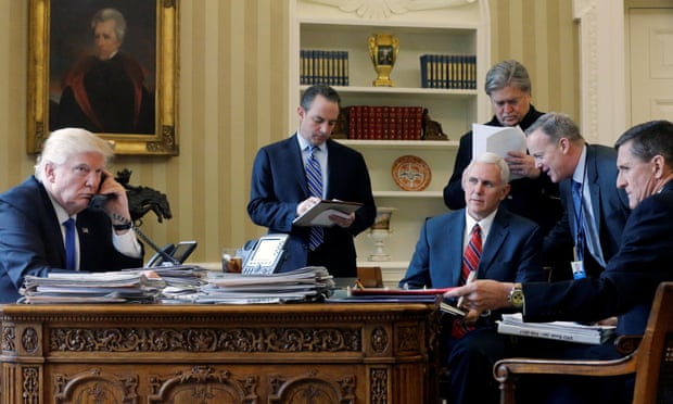 Donald Trump on the phone to Russia’s president Vladimir Putin, with chief of staff Reince Priebus, vice president Mike Pence, senior adviser Steve Bannon, communications director Sean Spicer and national security adviser Michael Flynn. Oval Office, White House, Washington, January 2017. REUTERS