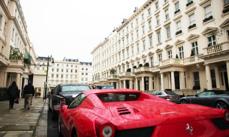 A Ferrari parked in a street in Kensington, where the average home costs £1.4m.