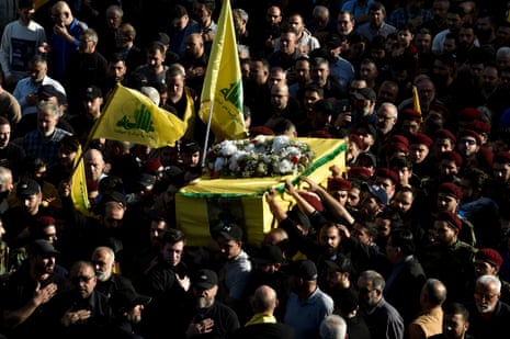 Supporters and relatives of late Hezbollah commander Ahmad Jawad Shahimi (Abu Hussein), carry his coffin during a funeral procession in southern Beirut, Lebanon.