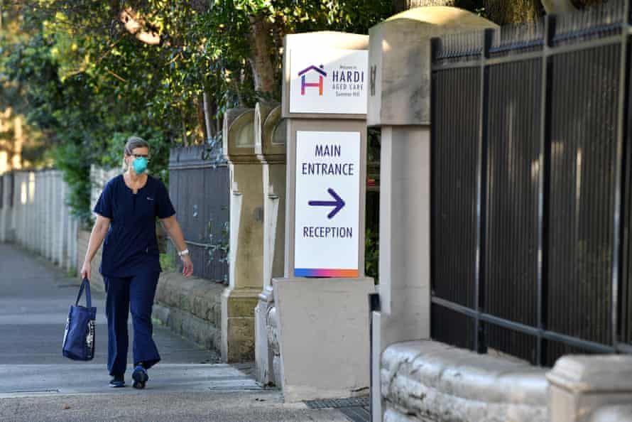 A worker arrives at the Hardi Aged Care Nursing Home Facility at Summer Hill in Sydney.
