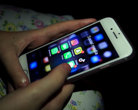 Someone looking at social media apps on a smartphone