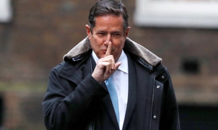 Jes Staley smiles and holds a finger over his lips