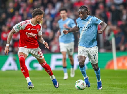 Jérémy Doku takes on Ben White during the Carabao Cup final.